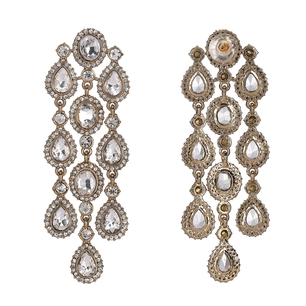 Model sporting silver chandelier earrings featuring layered crystal drops, ideal for weddings or night parties