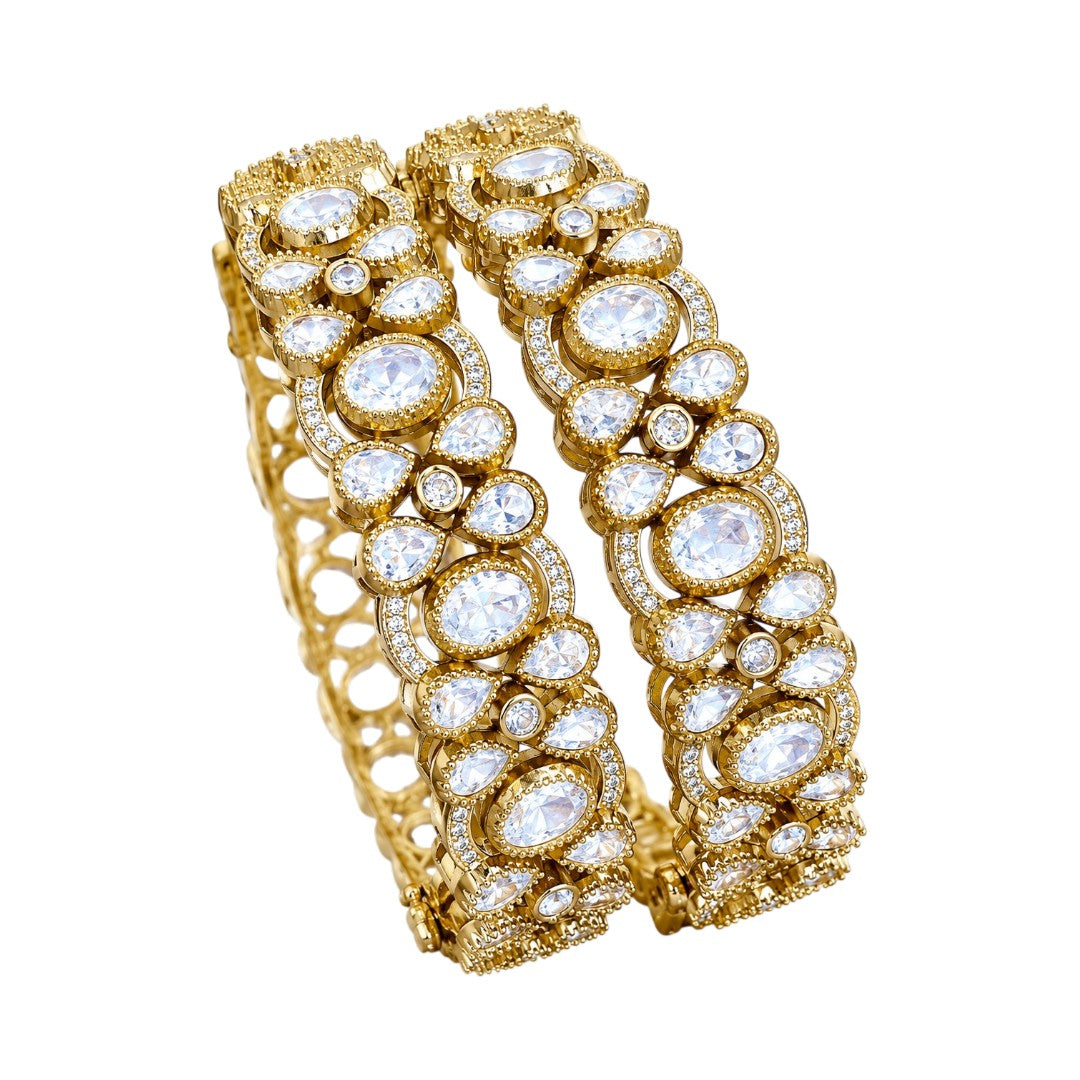 "Pair of wide gold-plated bridal bangles with bezel-set white crystals in openwork design"