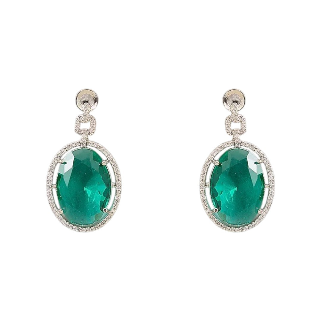 Silver plated American Diamond necklace set with emerald green oval pendant and matching drop earrings on white background