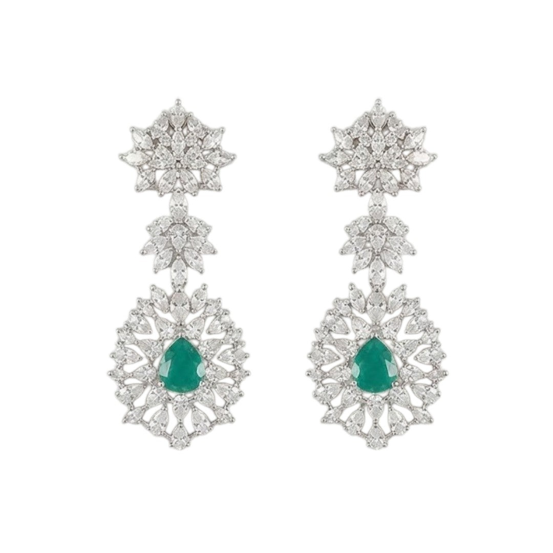 "Silver rhodium-plated bridal necklace set with white American diamonds and green emerald drop stones, paired with matching floral drop earrings"