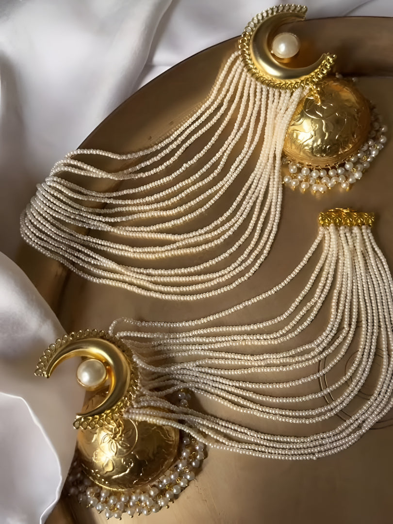 Gold-plated long pearl chain jhumka earrings for women with cascading pearl strands and statement ethnic design.