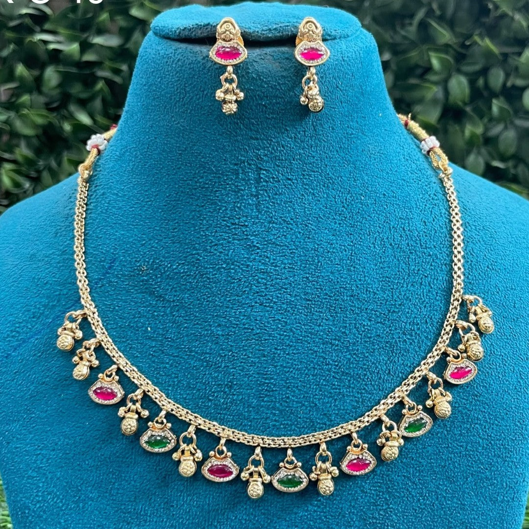 Antique gold finish necklace set with ruby pink and green marquise stone charms and gold bead drops