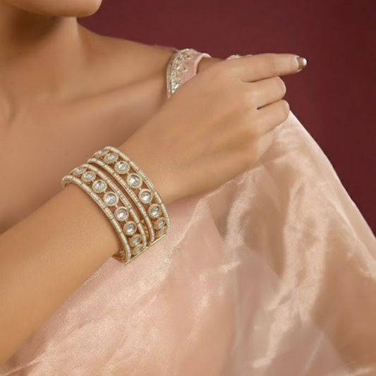Gold-plated traditional bangles with Kundan stones and pearl embellishments for women
