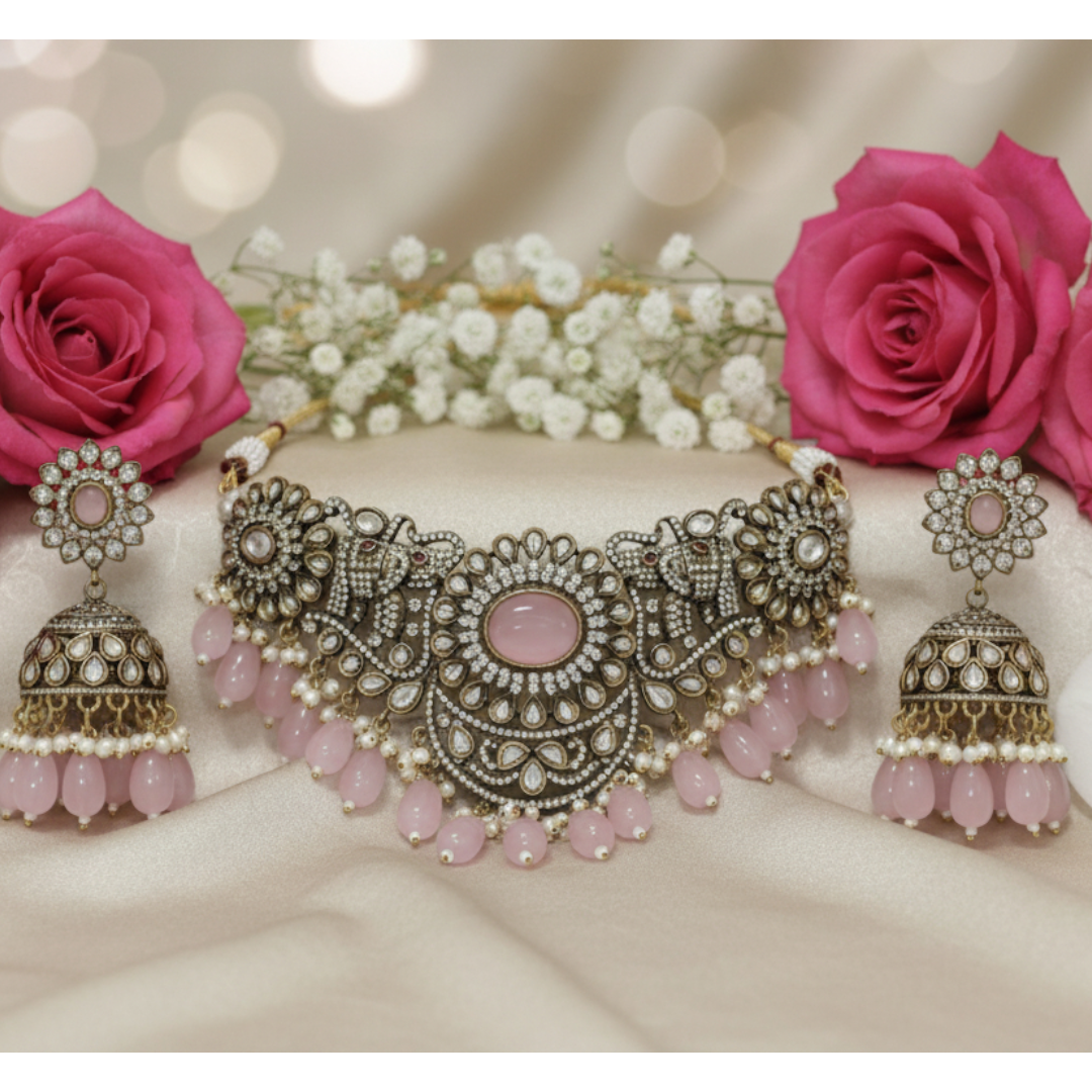 Antique oxidized choker necklace set with pink beads and floral motifs, paired with matching jhumka earrings โ traditional Indian jewelry