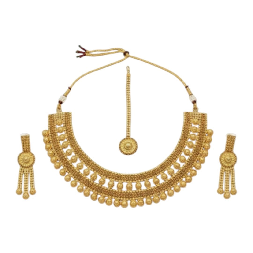 Traditional bridal gold-plated Kundan necklace set with matching earrings and maang tikka displayed on red velvet stand.