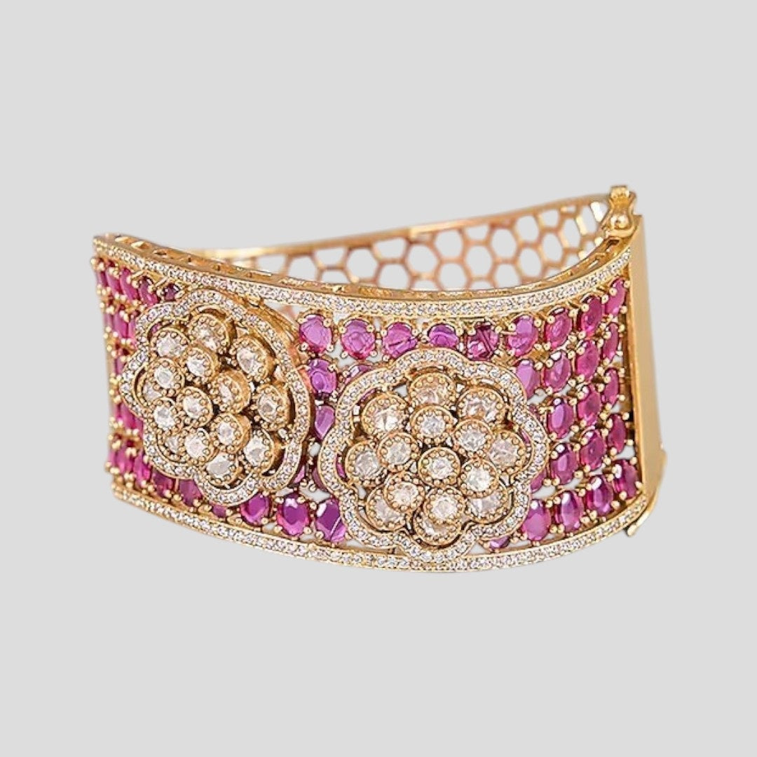 Woman wearing gold-plated ruby kundan floral bracelet kada