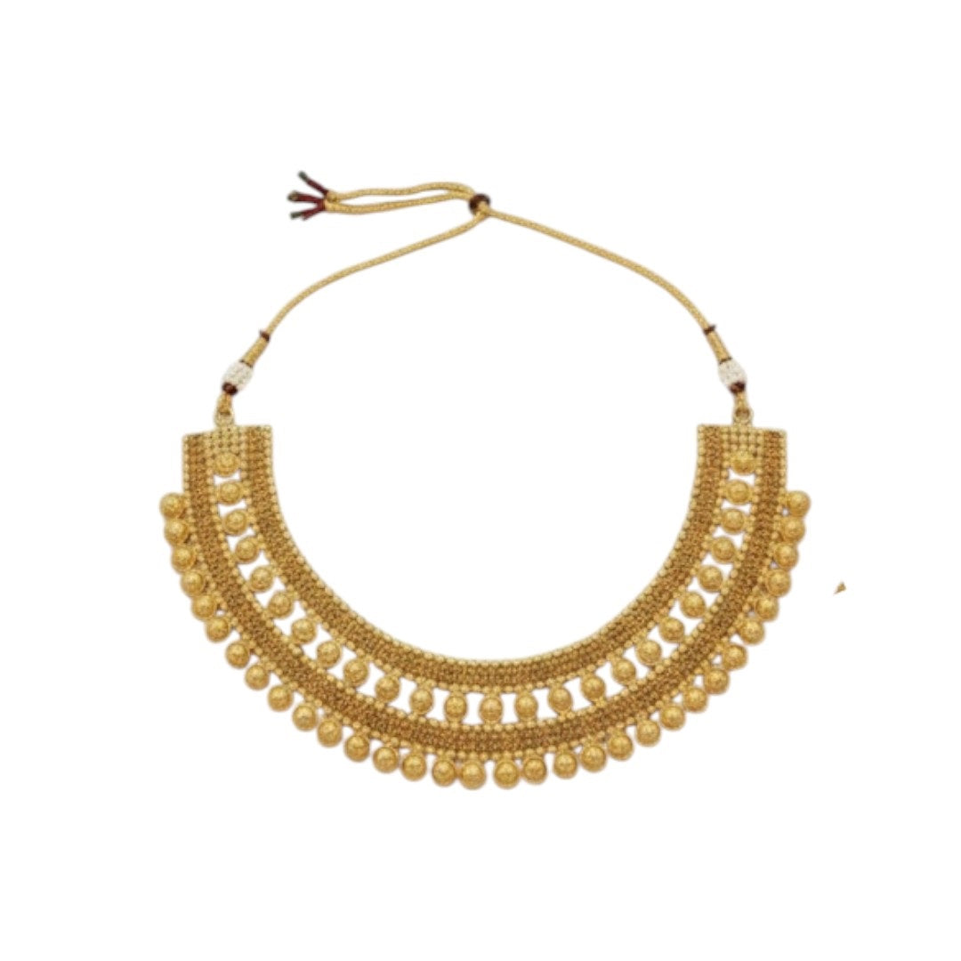 Traditional bridal gold-plated Kundan necklace set with matching earrings and maang tikka displayed on red velvet stand.