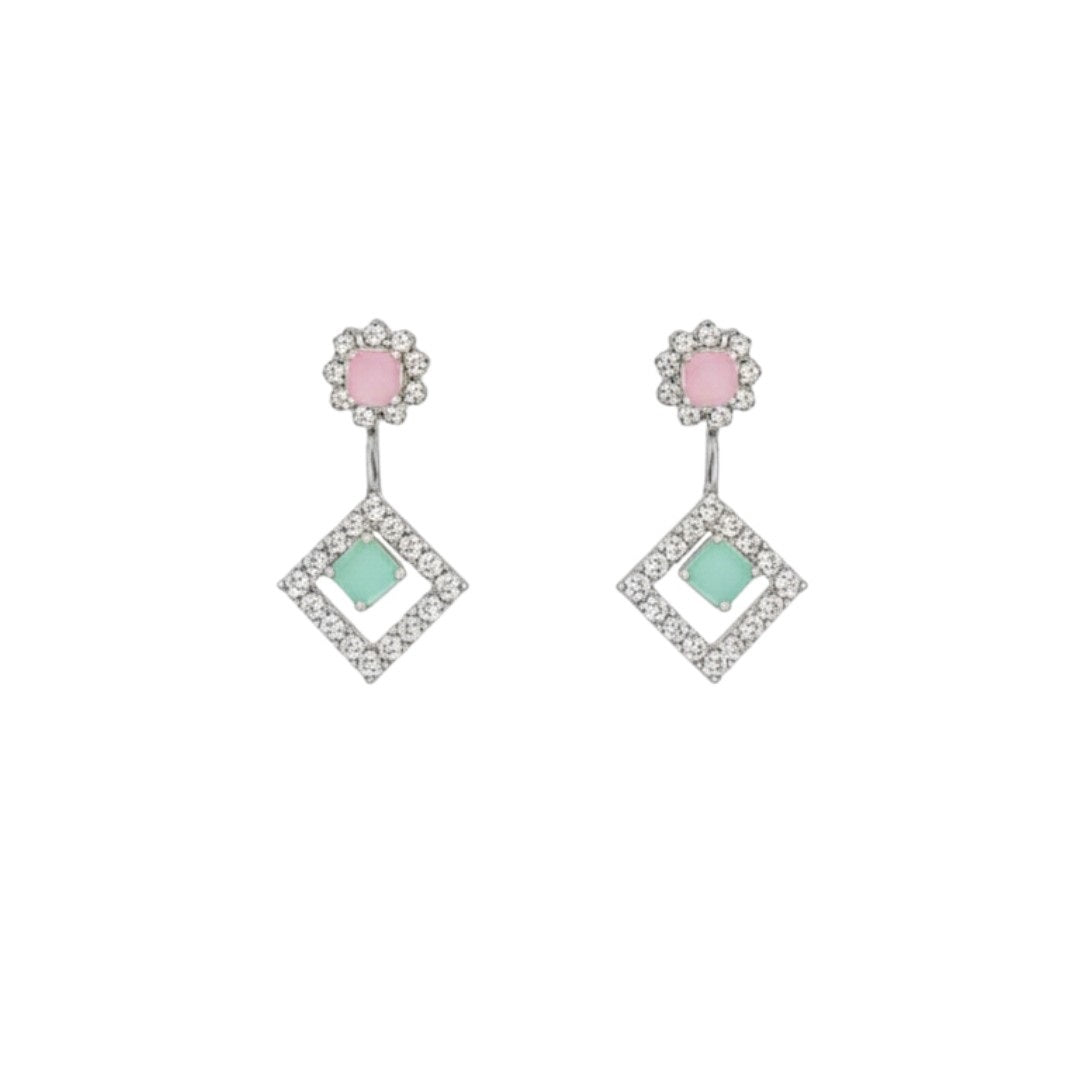 "Geometric pastel stone necklace and earring set displayed on a black velvet stand with floral centerpiece"