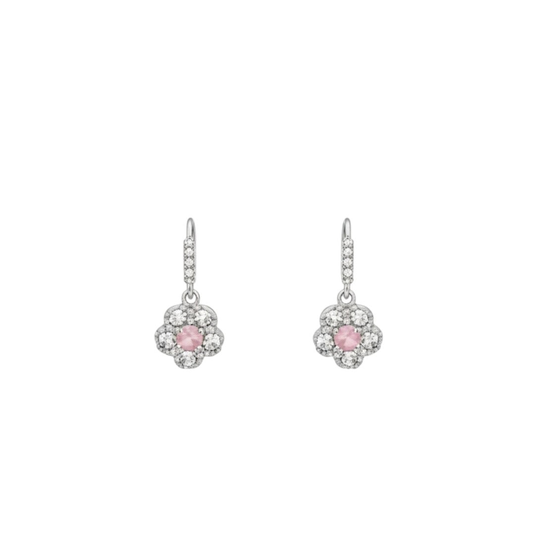 Silver floral necklace and matching earrings set with sparkling round crystals displayed on a red velvet jewelry stand, perfect for weddings and festive occasions.