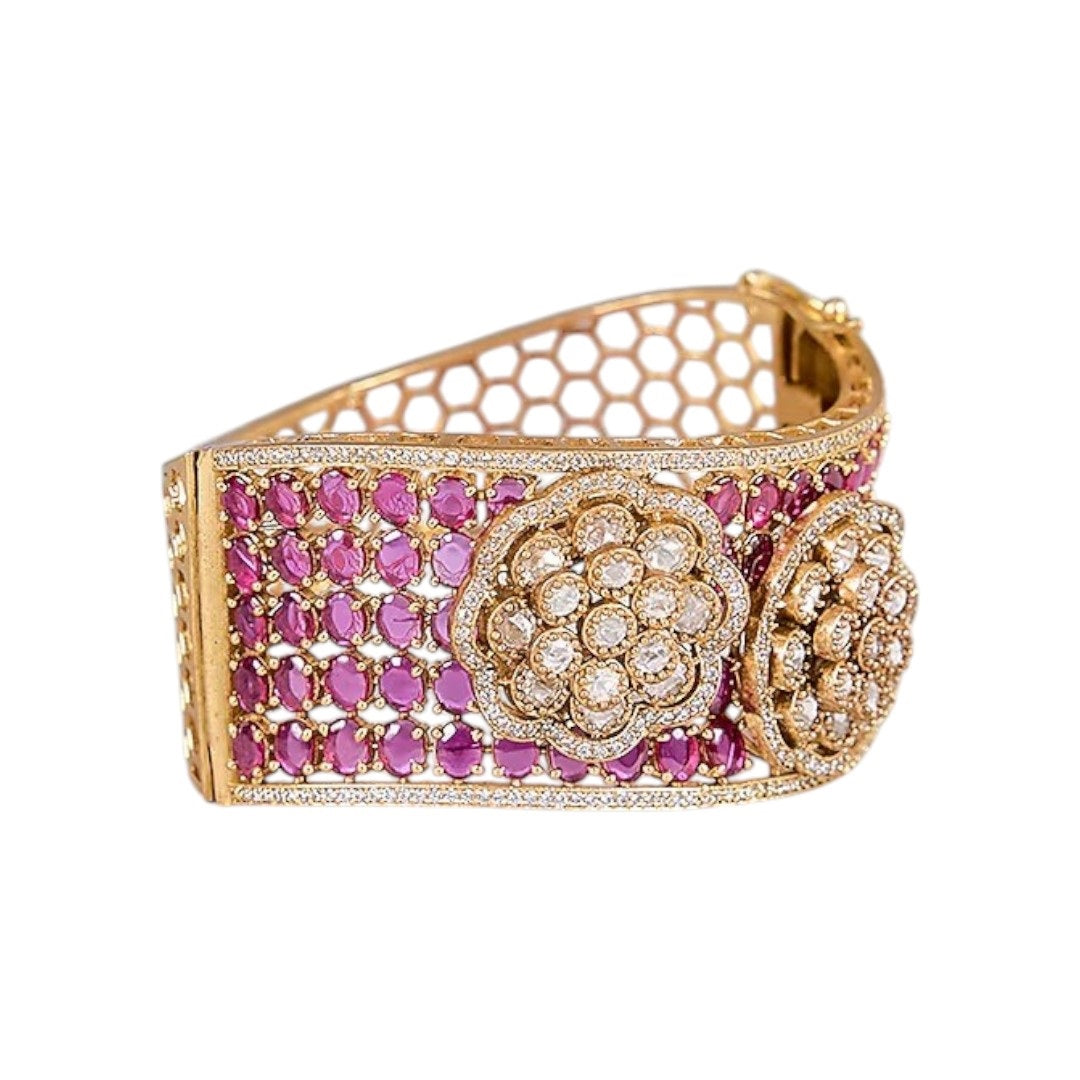 Woman wearing gold-plated ruby kundan floral bracelet kada