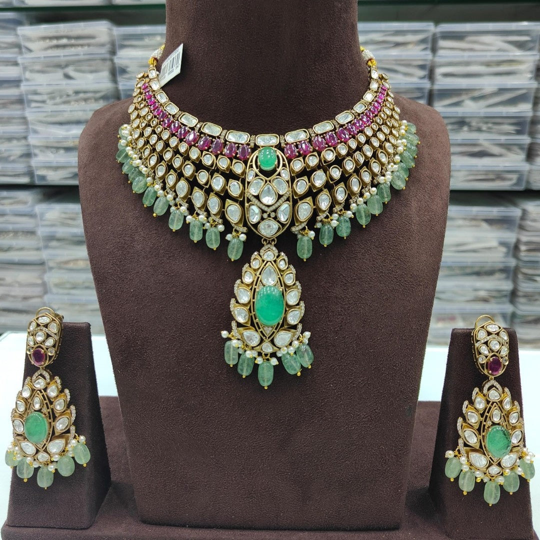 Luxury Green Kundan Bridal Choker Necklace Set with Ruby Stones, Pearl Drops, and Matching Earrings for Wedding and Traditional Wear.