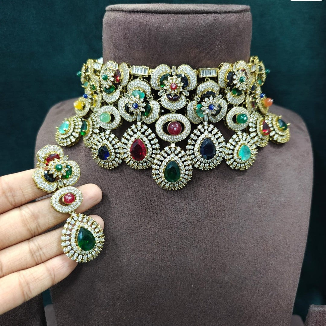 Luxury multicolor bridal choker necklace set with matching earrings featuring gold plating and premium CZ stones for wedding and party wear.