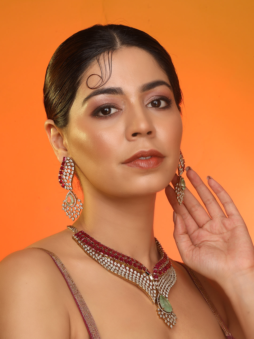 Gold plated ruby and emerald statement necklace set with matching earrings, bridal jewelry design with teardrop green stone and crystal detailing