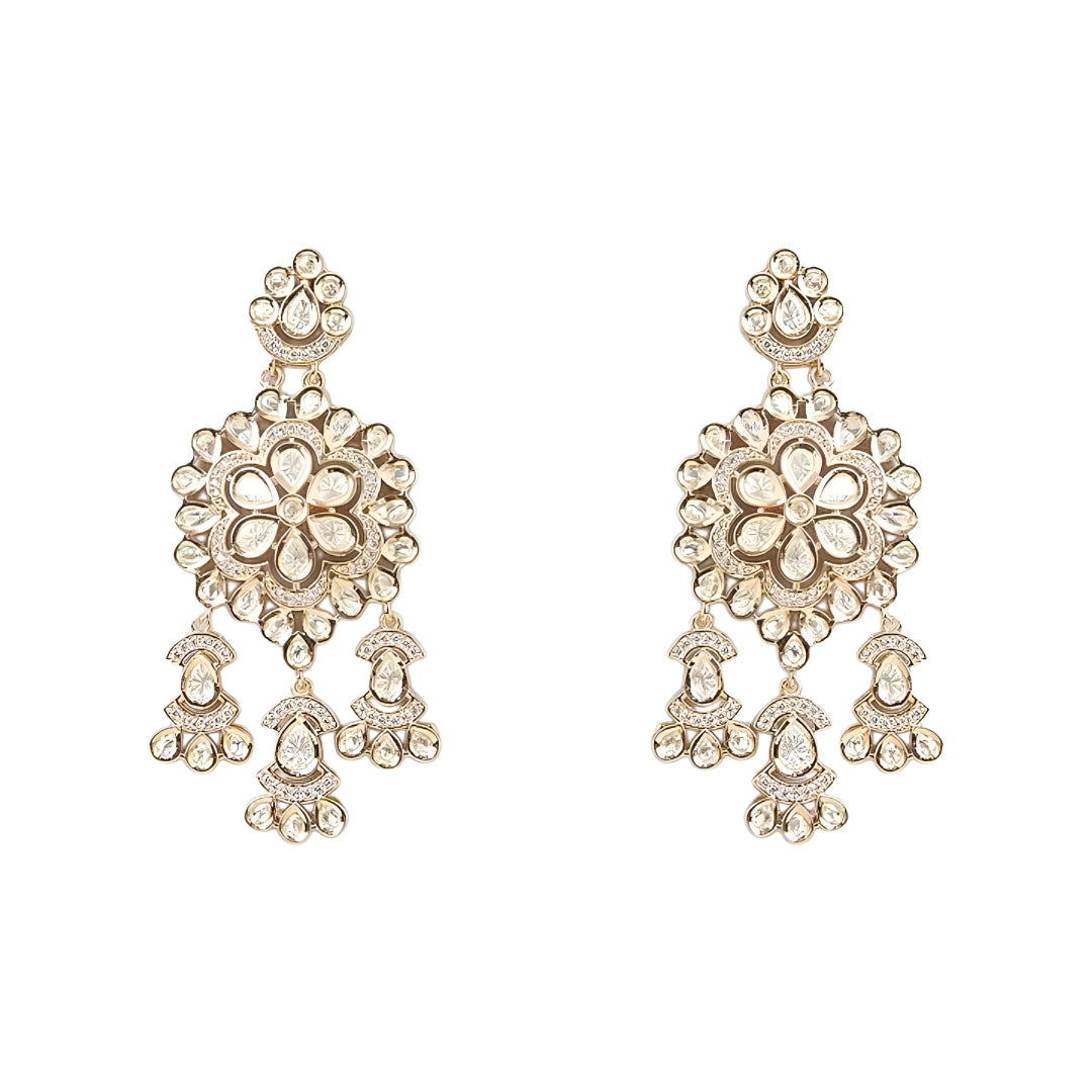 Gold-tone Kundan floral necklace set featuring a statement pendant with dangling accents and matching drop earrings on a white background.