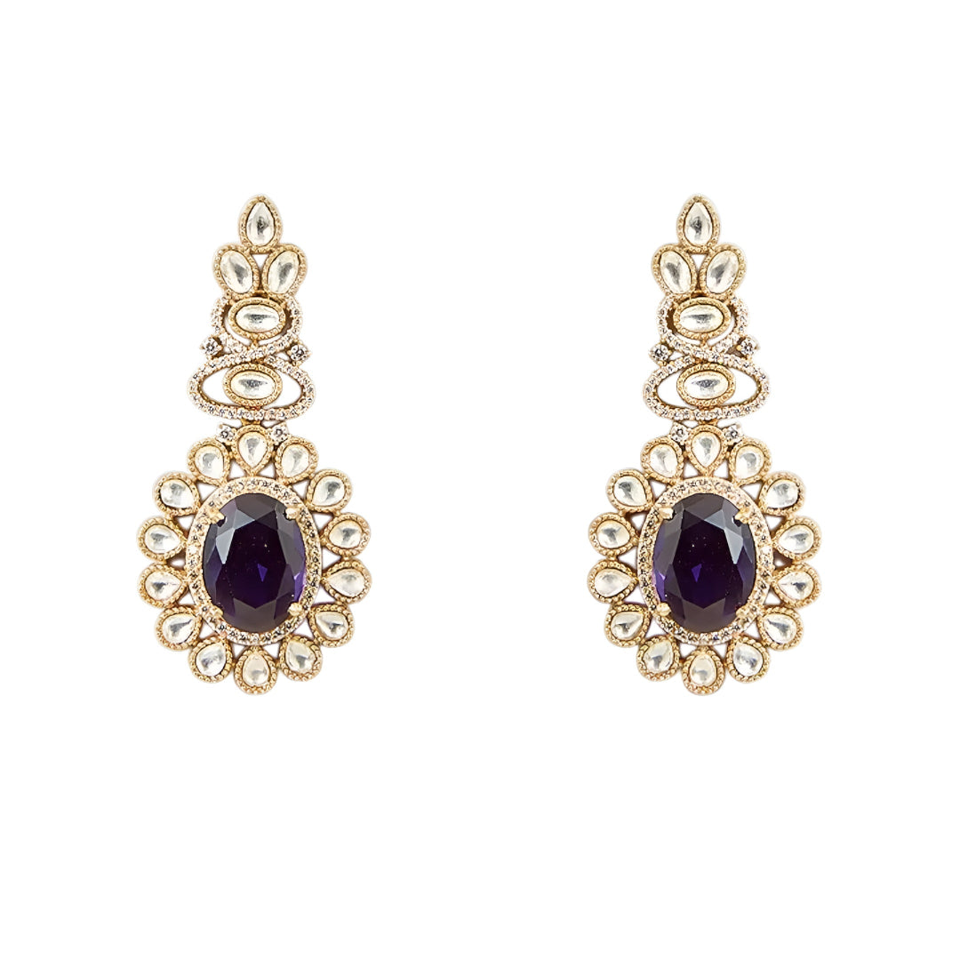 Gold-tone Kundan-inspired necklace and earrings set featuring white stones and deep purple oval gemstone accents in an elegant traditional design.