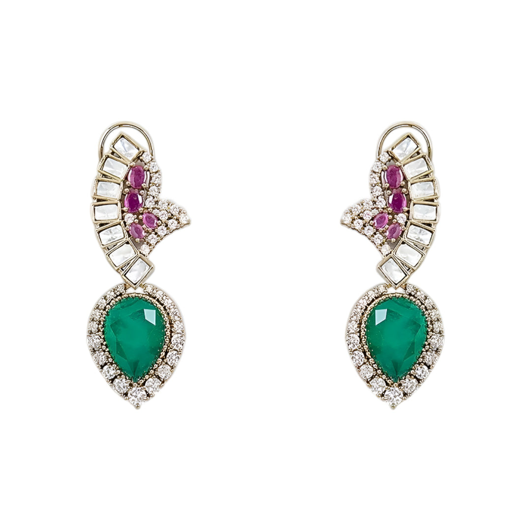 Luxury emerald, ruby and diamond necklace set with matching earrings in white gold featuring pear-shaped emerald gemstones, pink ruby accents and sparkling diamond detailing.