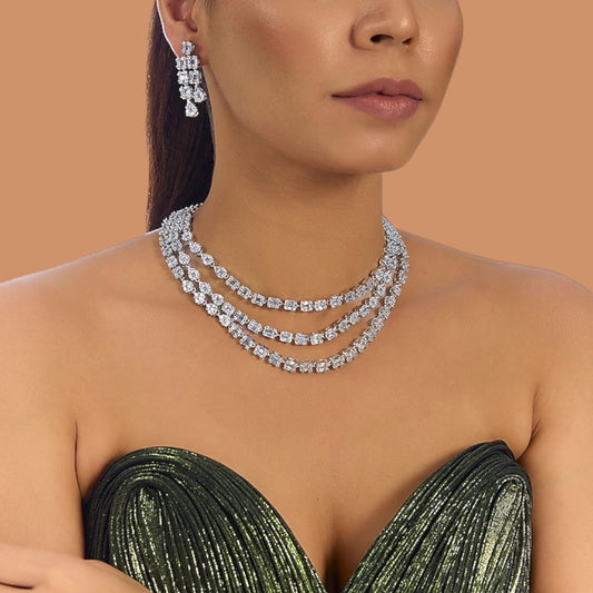 “Elegant silver-tone layered diamond necklace set with matching drop earrings for women”