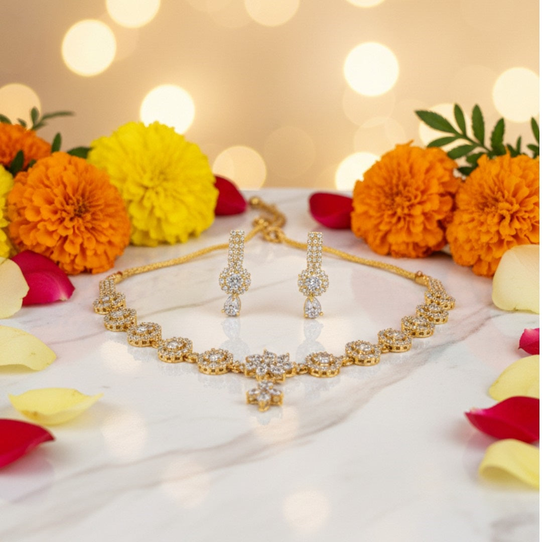 "Gold-plated floral diamond necklace set with matching earrings displayed on red velvet stand – ideal for weddings and festive occasions."
