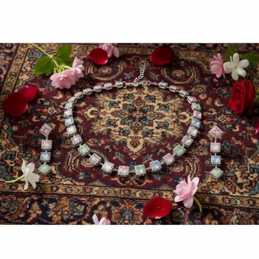 "Elegant pastel pink and green stone necklace with matching earrings displayed on black velvet stand"