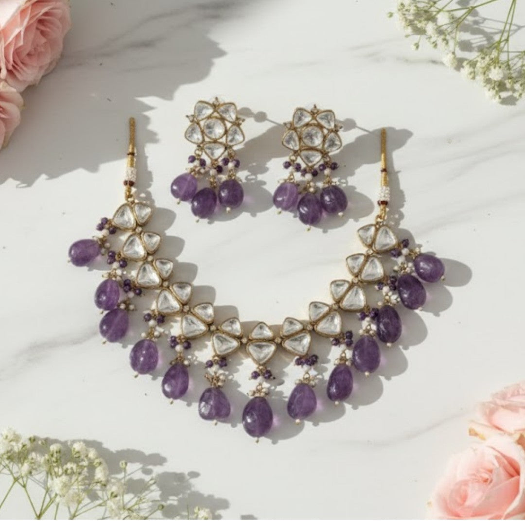 Elegant kundan choker necklace set with amethyst stones and pearl detailing, perfect for weddings and festive occasions.
