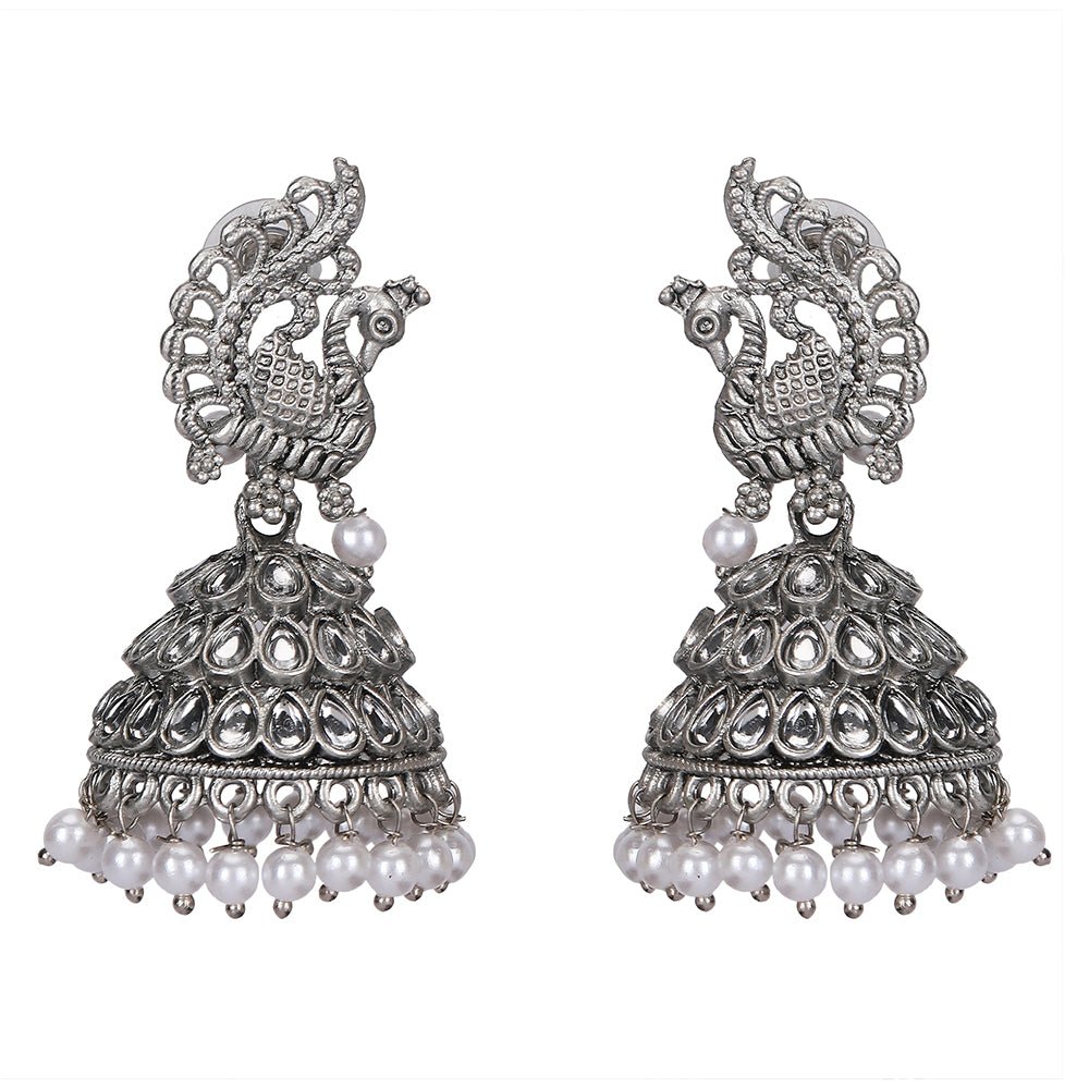 Buy Aviana Silver - Plated Crystal Studded Traditional Jhumka Earrings for Women - Auraa Trends - Jhumka - - Auraa Trends - Lady wearing silver - plated crystal peacock pattern jhumka earrings with pearl drops, Indian ethnic traditional jewellery