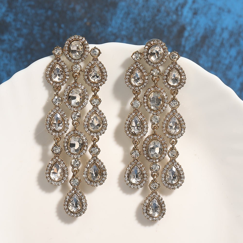 Buy Aviana Statement Crystal Chandelier Earrings in Silver Finish - Auraa Trends - Chandelier Earrings - - Auraa Trends - Model sporting silver chandelier earrings featuring layered crystal drops, ideal for weddings or night parties