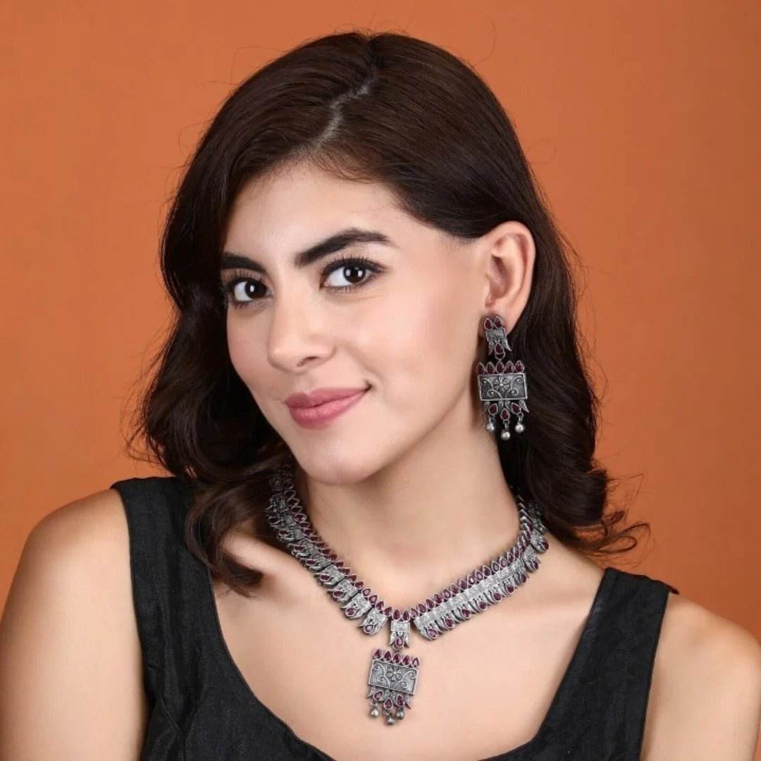 Buy Aviana Tribal Oxidized Silver-Plated Necklace Set Featuring Red Stone Embellishments and Dangling Drop Earrings - Auraa Trends