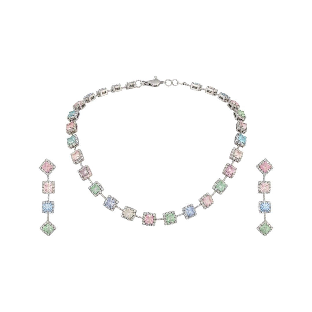 "Elegant pastel pink and green stone necklace with matching earrings displayed on black velvet stand"