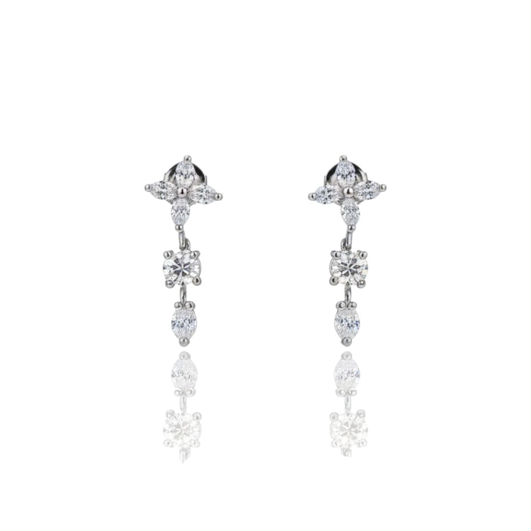 Elegant floral silver choker necklace set with matching earrings displayed on red velvet jewelry stand