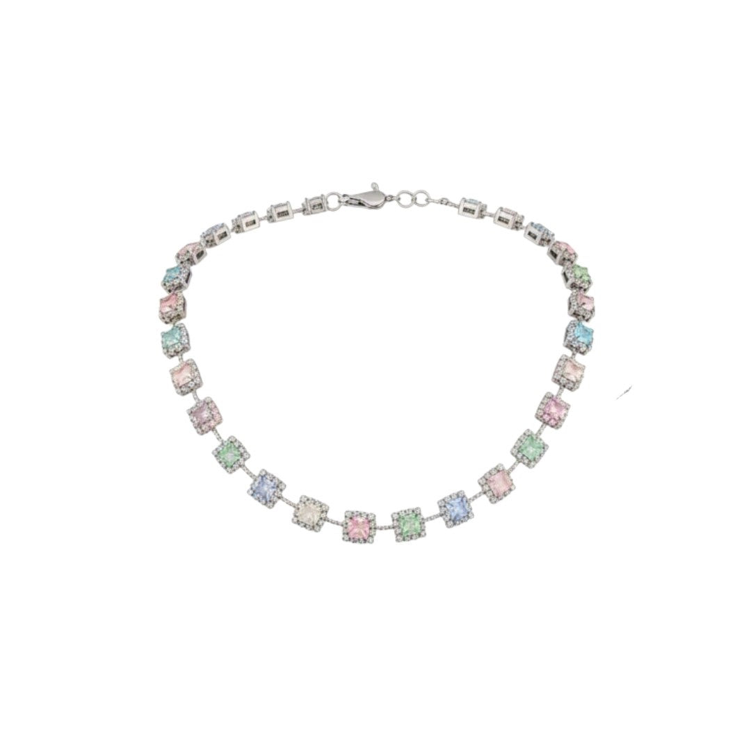 "Elegant pastel pink and green stone necklace with matching earrings displayed on black velvet stand"