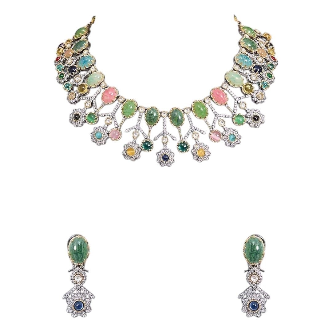 Designer Multicolor Polki Kundan Choker Necklace Set with Earrings for Women - Auraa Trends - Necklace Set - - Auraa Trends - Woman wearing a handcrafted multicolor polki kundan choker necklace set with matching earrings, paired with a pastel embroidered saree.
