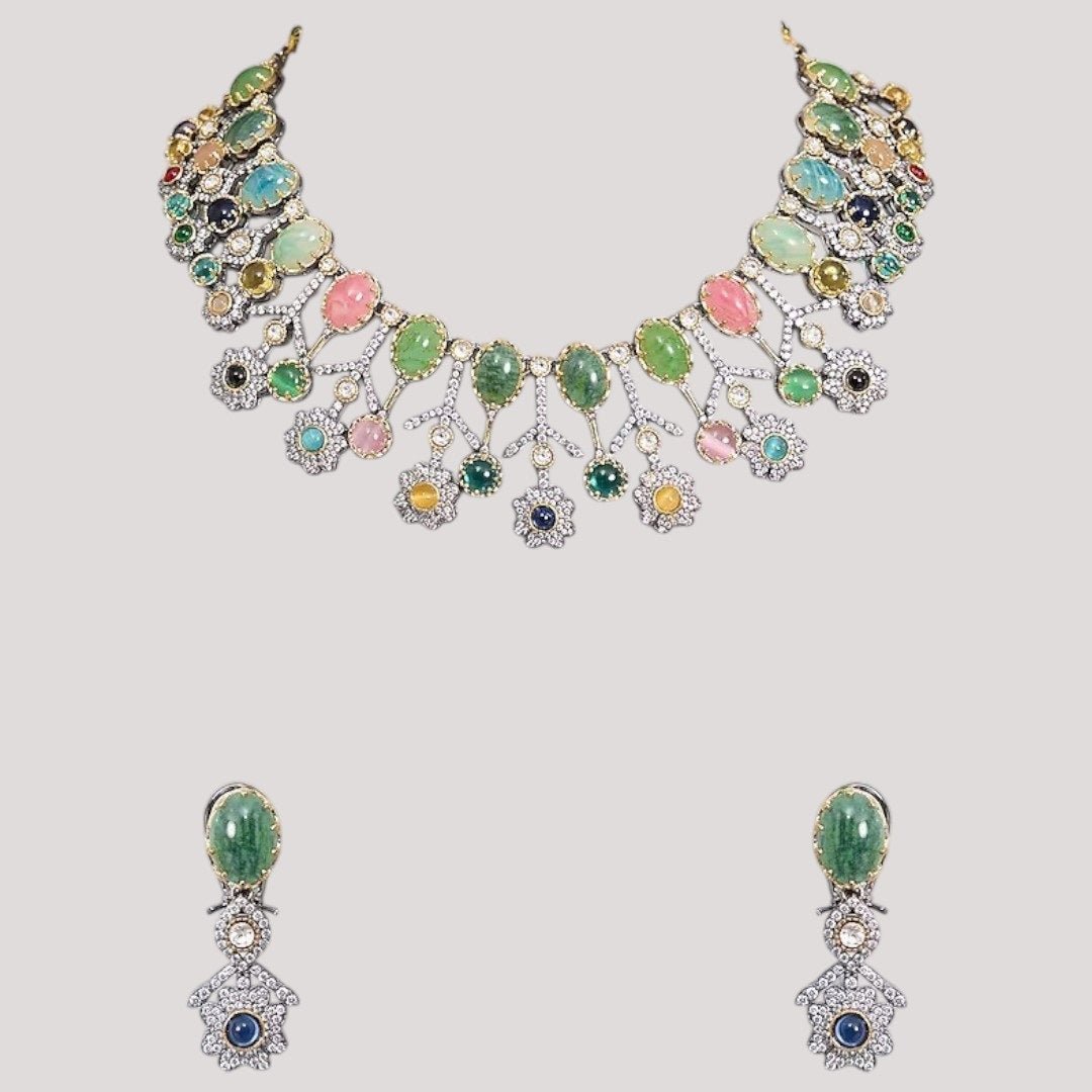 Designer Multicolor Polki Kundan Choker Necklace Set with Earrings for Women - Auraa Trends - Necklace Set - - Auraa Trends - Woman wearing a handcrafted multicolor polki kundan choker necklace set with matching earrings, paired with a pastel embroidered saree.