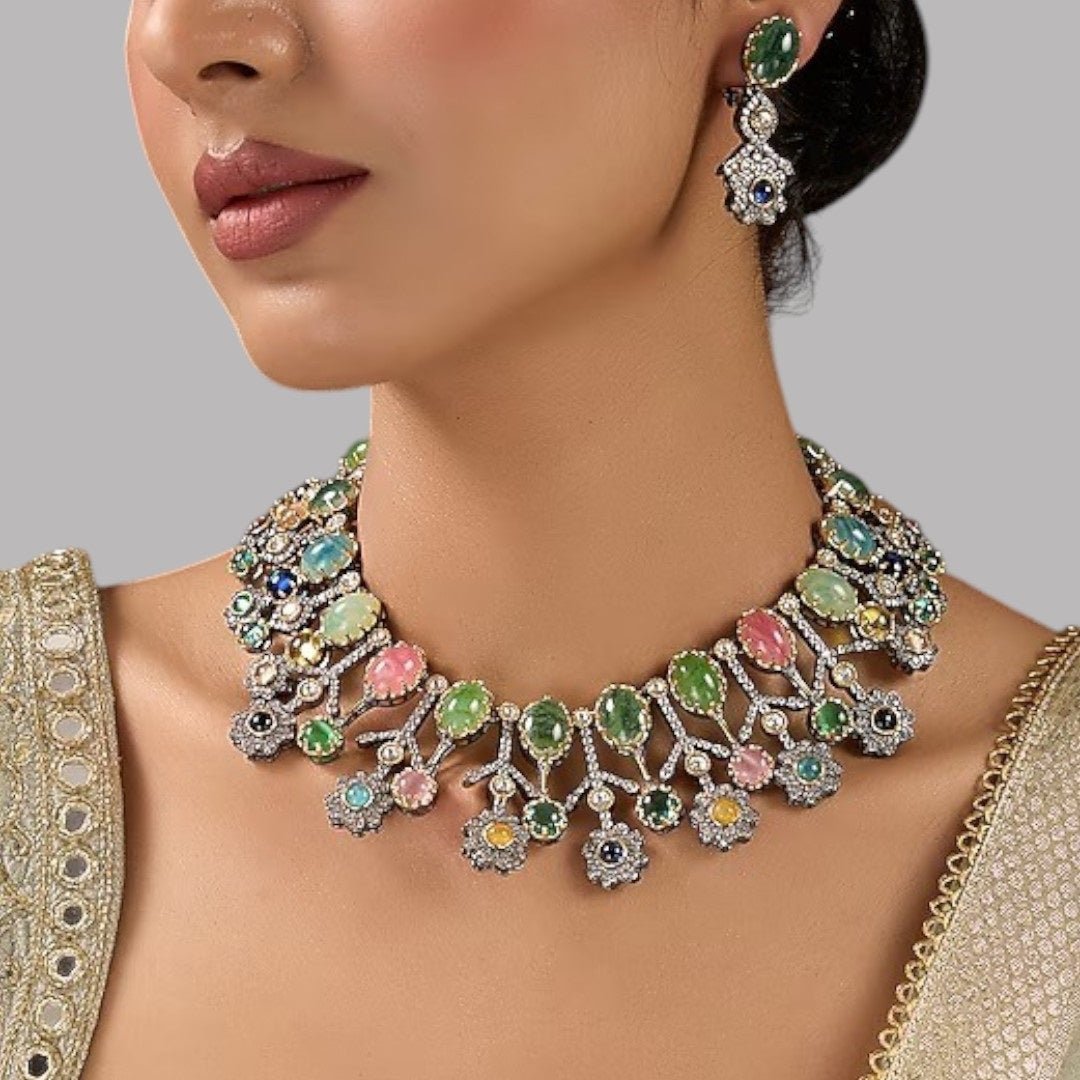 Designer Multicolor Polki Kundan Choker Necklace Set with Earrings for Women - Auraa Trends - Necklace Set - - Auraa Trends - Woman wearing a handcrafted multicolor polki kundan choker necklace set with matching earrings, paired with a pastel embroidered saree.