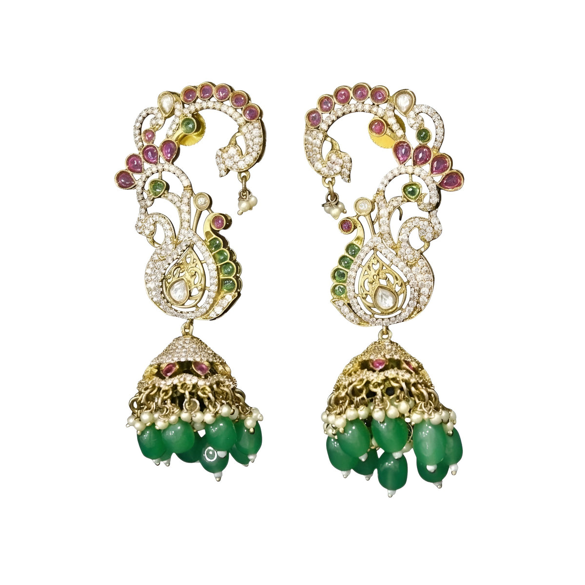 Gold plated peacock design jhumka earrings with American diamond stones, ruby pink accents and green bead and pearl hangings on a white background