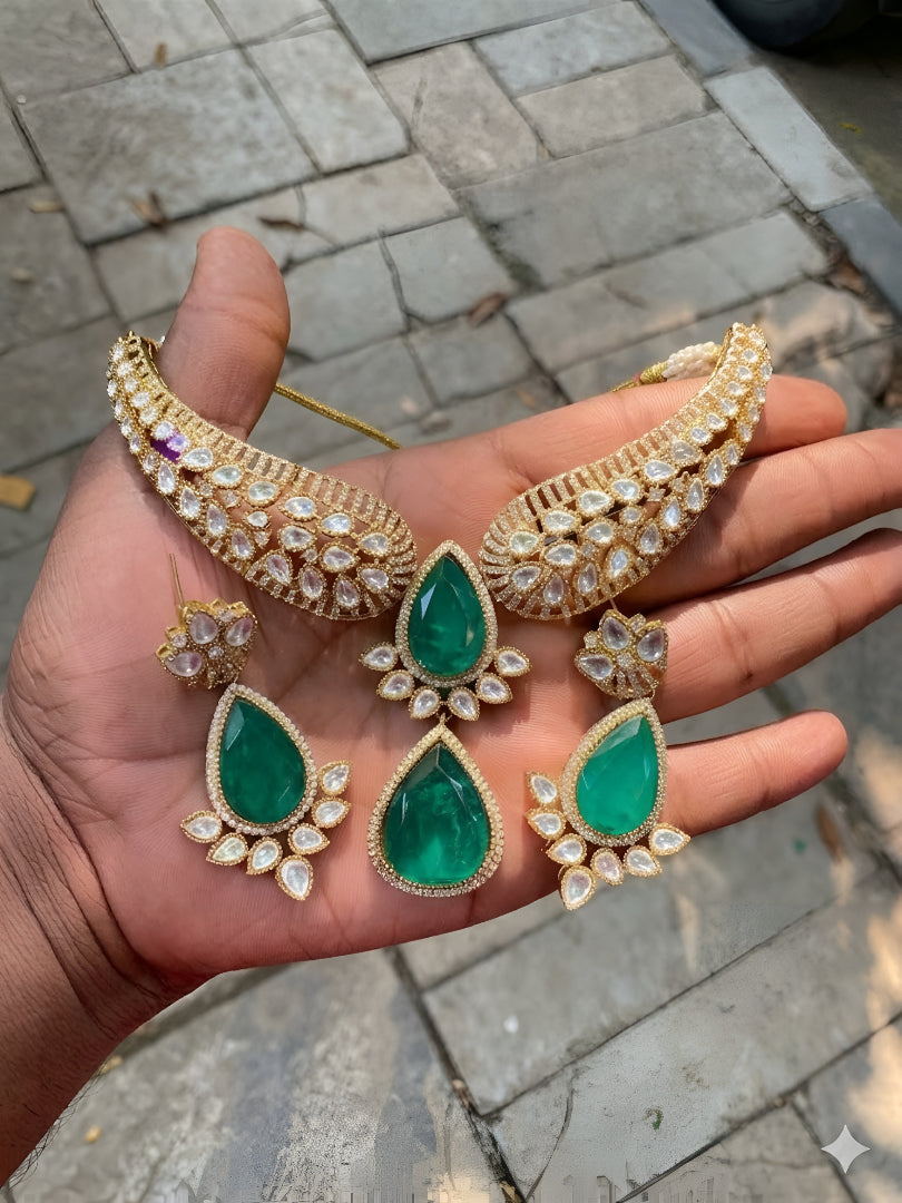Gold Kundan necklace set with green teardrop pendant and matching earrings