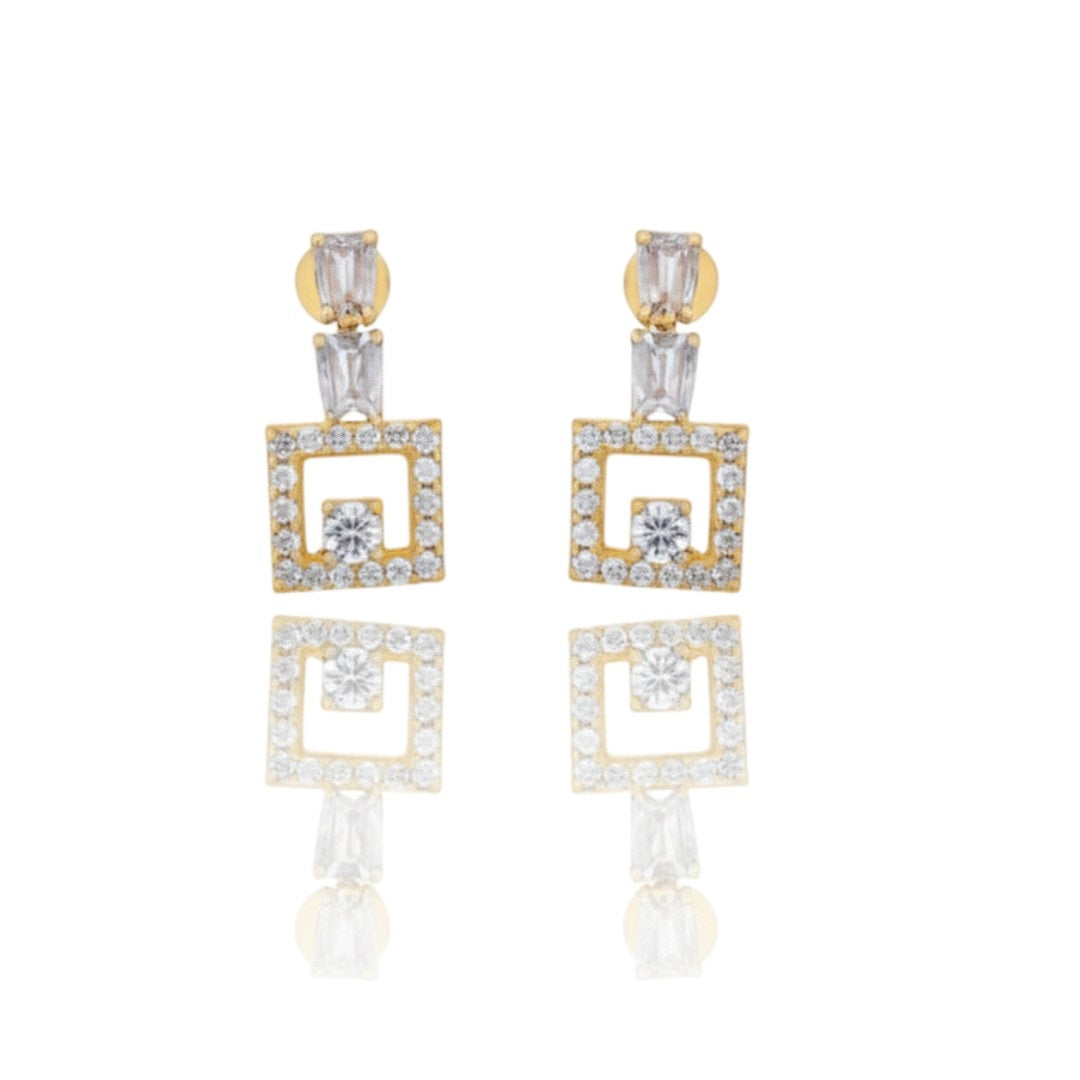 "Gold-plated American diamond necklace set with geometric square design and matching earrings on red display stand"