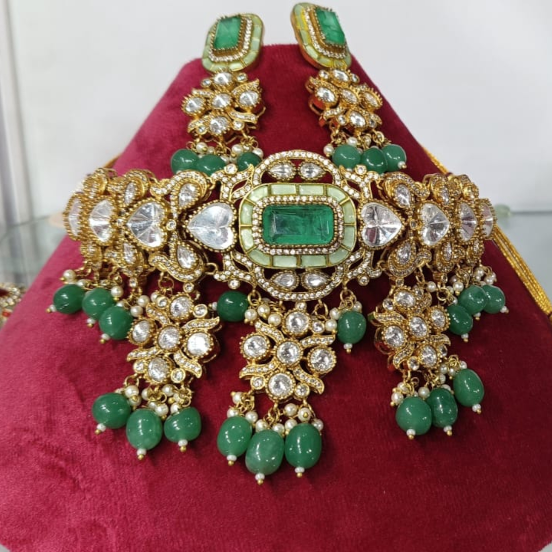 "Gold-plated kundan choker necklace set with green beads and matching earrings – traditional Indian jewelry for women"