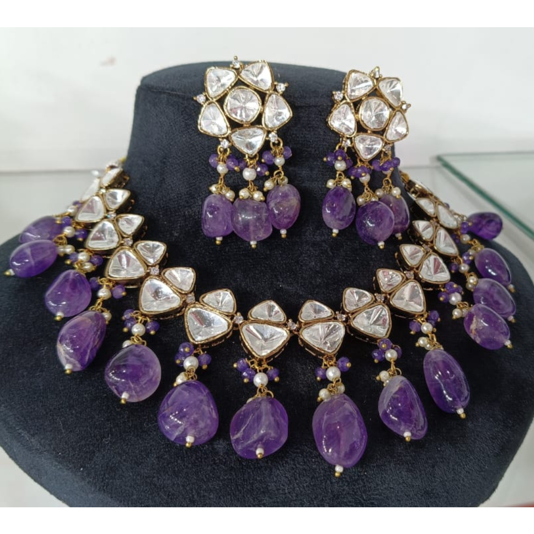 Elegant kundan choker necklace set with amethyst stones and pearl detailing, perfect for weddings and festive occasions.