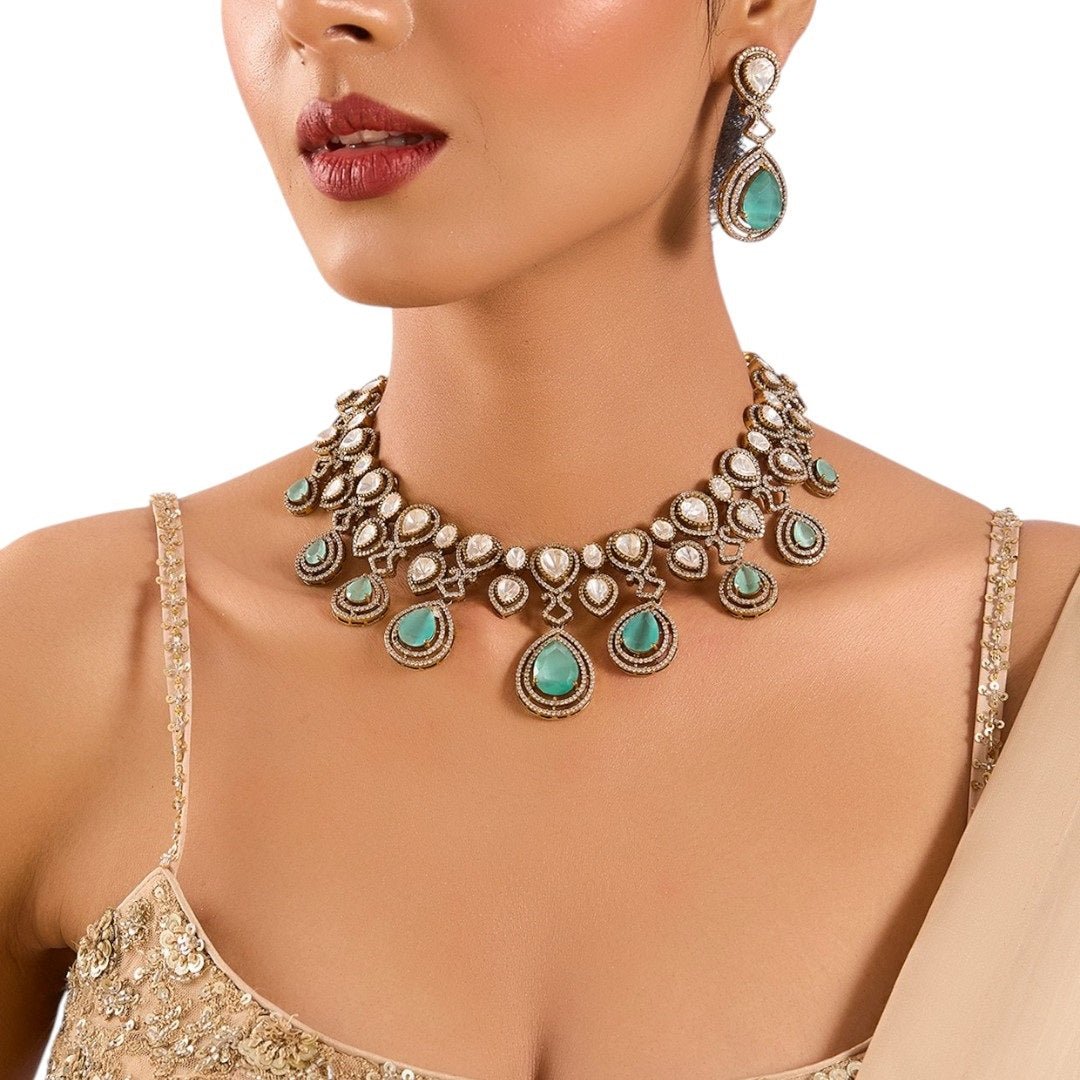 Gold Finish Kundan Polki Choker Necklace Set with Mint Green Drops – Bridal Jewelry Set - Auraa Trends - necklace - - Auraa Trends - Gold finish Kundan Polki choker necklace with pearls and mint green drops Indian bridal choker necklace set with matching earrings Traditional gold plated choker with Kundan stones and pearl accents Mint green drop choker necklace for wedding or festive wear Ethnic Indian jewelry set with earrings – Kundan and pearl choker