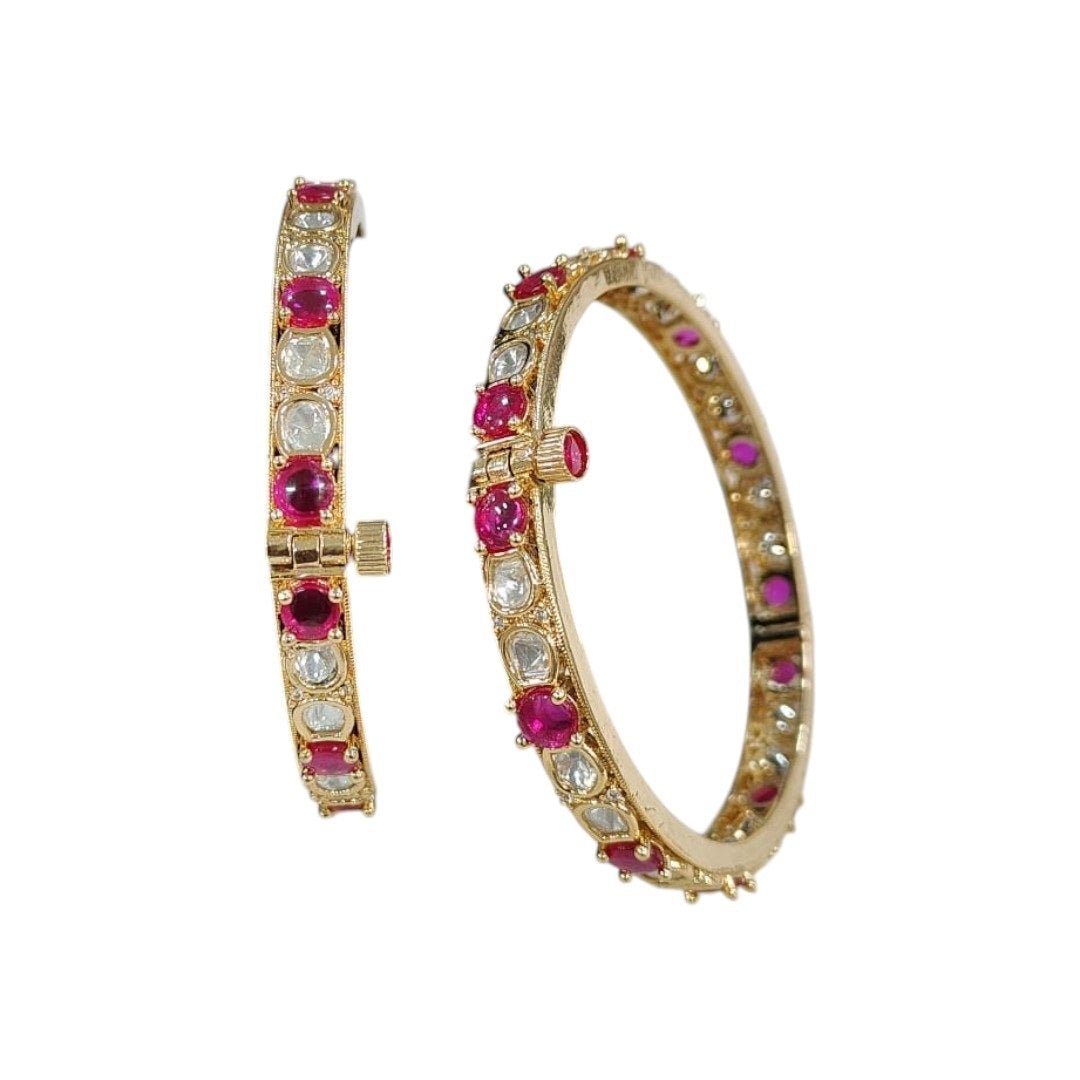 Gold - Plated Bangles with Pink and White Stones - Auraa Trends - Bangles - - Auraa Trends - Gold - plated bangles with alternating pink and white stones, displayed on a green velvet roll against a white background – ethnic kada set for women.