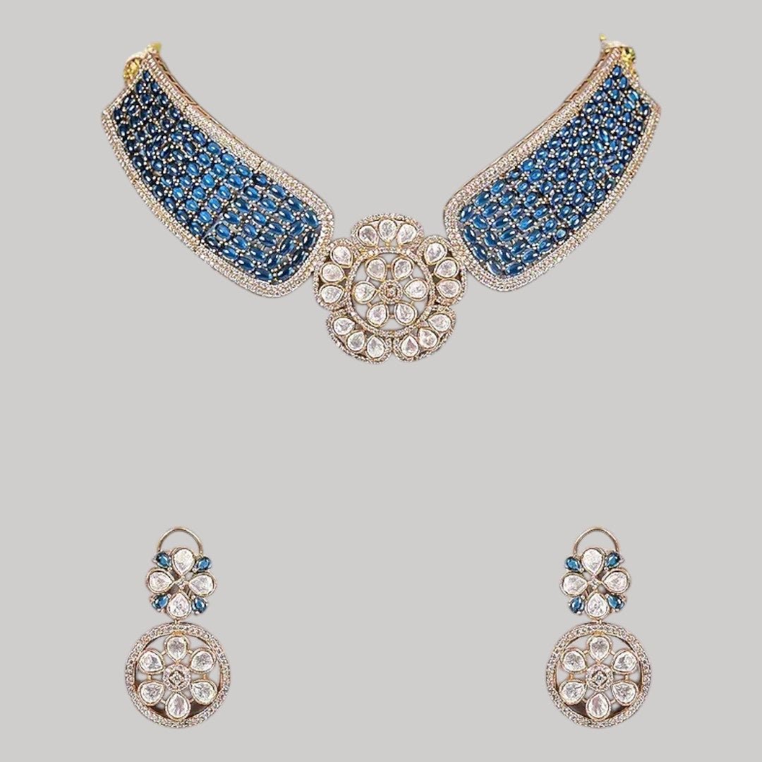 Gold - Plated Blue Stone Encrusted Choker Necklace Set with Floral Earrings - Auraa Trends - Necklace Set - - Auraa Trends - Model wearing a gold - plated blue stone choker necklace set with kundan - style floral centerpiece and matching floral earrings, perfect for modern ethnic looks.
