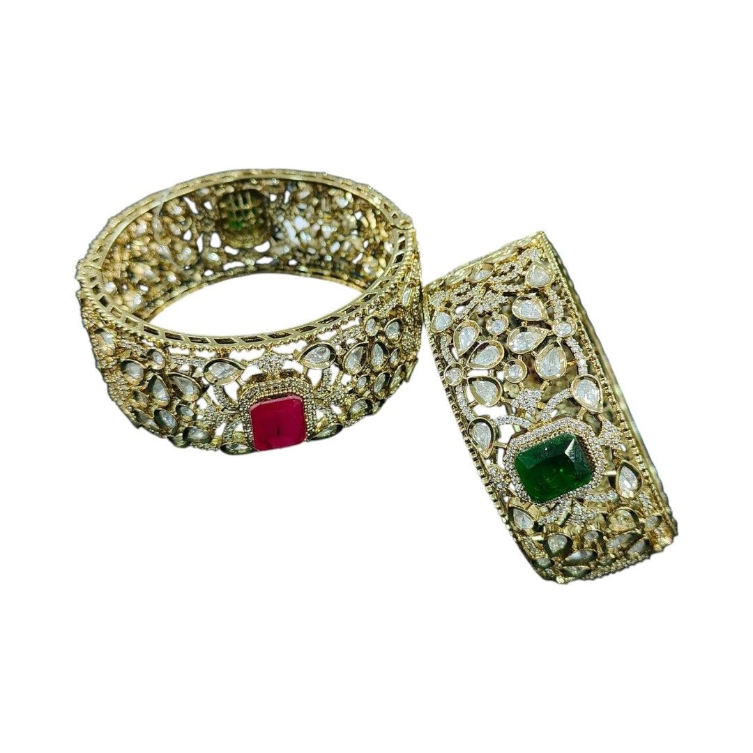 Gold - Plated Kundan Bangles with Pink & Green Square Stone - Auraa Trends - Bangles - - Auraa Trends - Pair of gold - plated traditional kundan bangles with green and pink square center stones, displayed with floral decor on textured background.โ