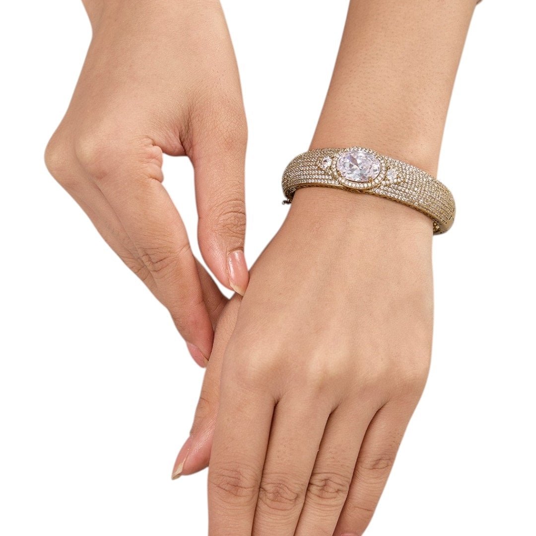 Gold - Plated Statement Bangle with Oval CZ Stone and Pave Crystal Detailing - Auraa Trends - Bangles - - Auraa Trends - Gold plated statement bangle with oval cubic zirconia and micro pave setting for party and bridal wear