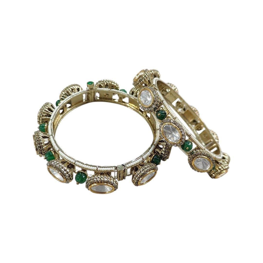 Gold - Plated Traditional Kundan Bangles with Green Beads and Dome Motifs - Auraa Trends - Bangles - - Auraa Trends - Close - up of gold - plated traditional kundan bangles with oval white stones, antique dome motifs, and green bead detailing β bridal ethnic jewelry for women