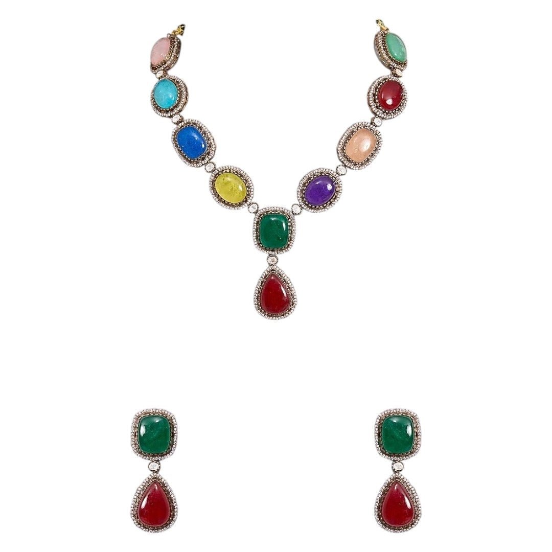 Luxury Multicolor Stone Statement Necklace Set with Earrings for Women - Auraa Trends - Necklace Set - - Auraa Trends - Woman wearing a luxury multicolor gemstone statement necklace set with bold matching earrings, styled with a traditional embroidered saree blouse.