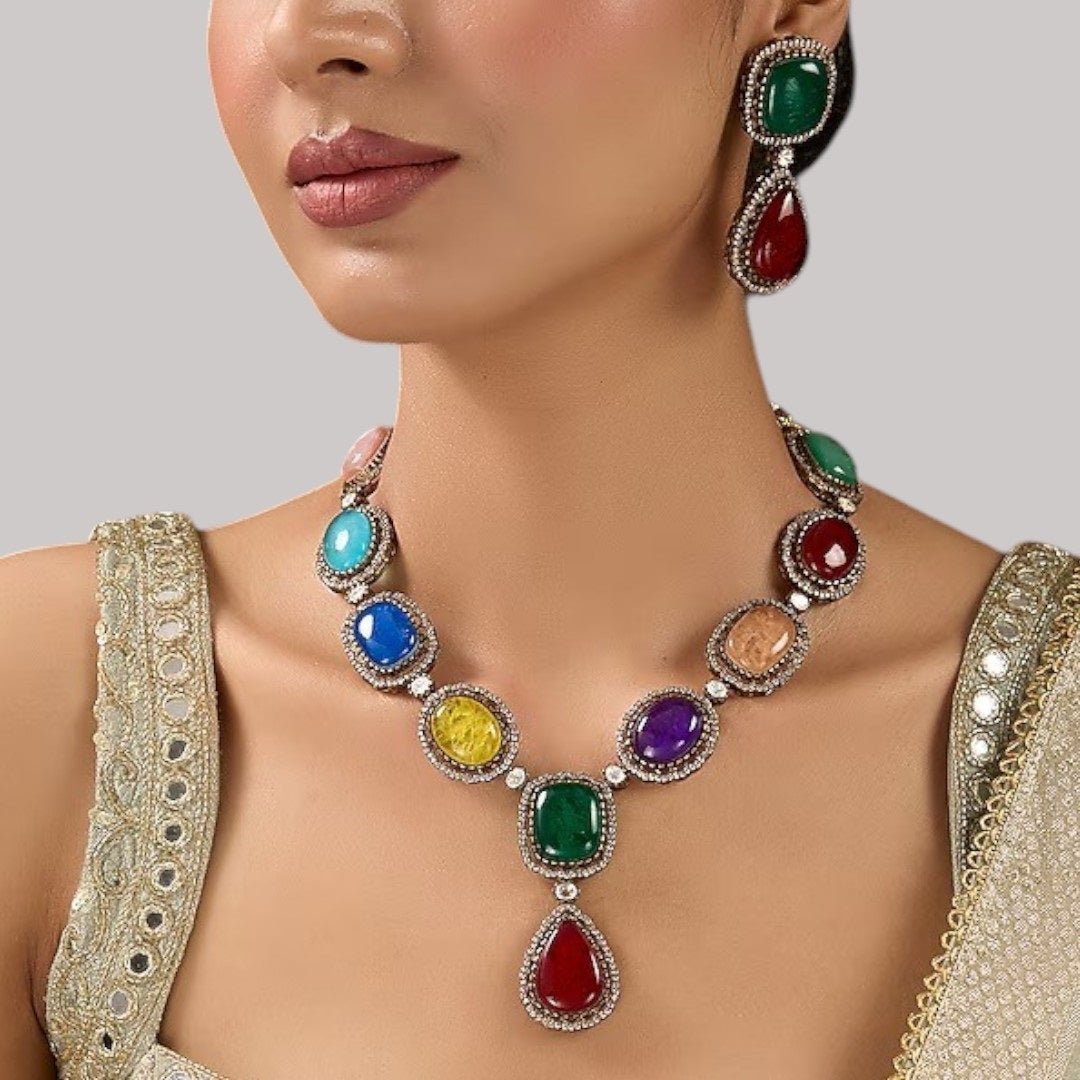 Luxury Multicolor Stone Statement Necklace Set with Earrings for Women - Auraa Trends - Necklace Set - - Auraa Trends - Woman wearing a luxury multicolor gemstone statement necklace set with bold matching earrings, styled with a traditional embroidered saree blouse.