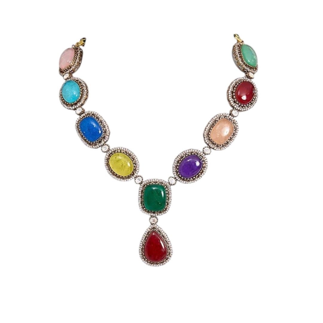 Luxury Multicolor Stone Statement Necklace Set with Earrings for Women - Auraa Trends - Necklace Set - - Auraa Trends - Woman wearing a luxury multicolor gemstone statement necklace set with bold matching earrings, styled with a traditional embroidered saree blouse.