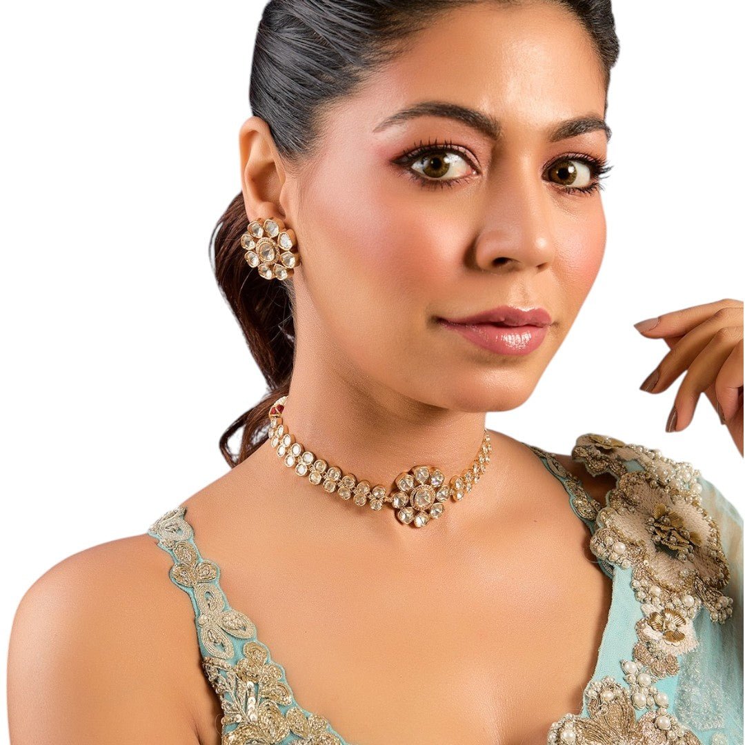 Stunning Gold - Plated Kundan Choker Necklace Set with Coordination Stud Earrings - Auraa Trends - Choker - # - Auraa Trends - complemented by floral stud earrings, paired with a pastel blue embroidered saree top