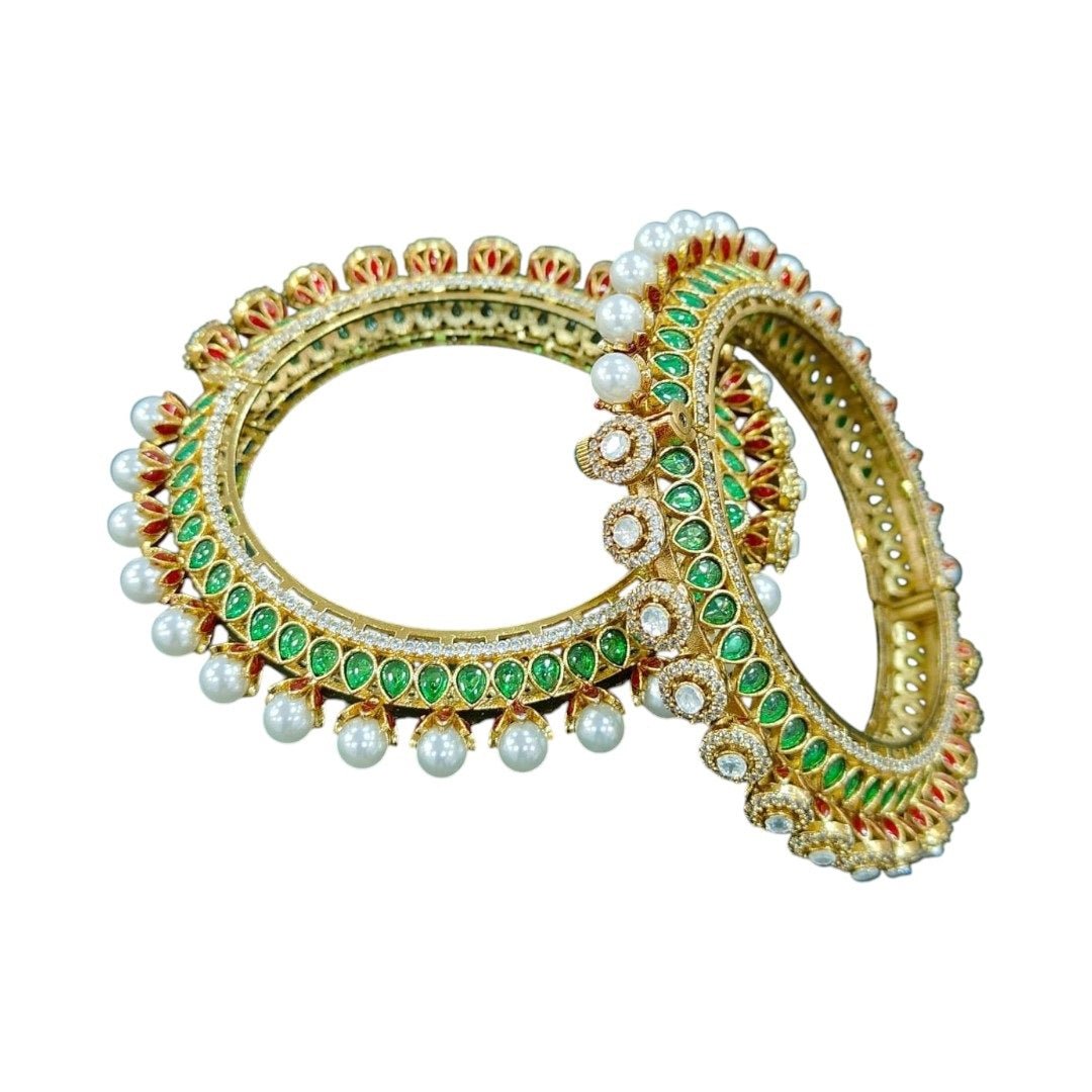 Traditional Gold - Plated Kundan & Pearl Studded Bangles with Green & Red Enamel Work - Auraa Trends - Bangles - - Auraa Trends - “Traditional gold - plated bangles with green and red enamel, kundan stones, and pearl detailing – set of 2 on velvet background.”