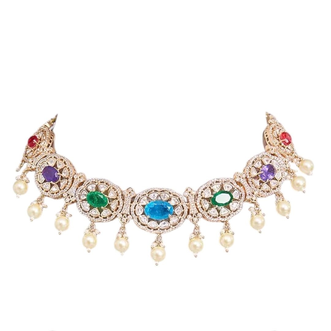Traditional Gold - Tone Pearl Drop Multicolor Choker Necklace Set with Earrings for Women - Auraa Trends - Necklace Set - - Auraa Trends - Woman wearing a gold - tone multicolor gemstone choker necklace with pearl drops and matching earrings, styled with an embroidered saree blouse.